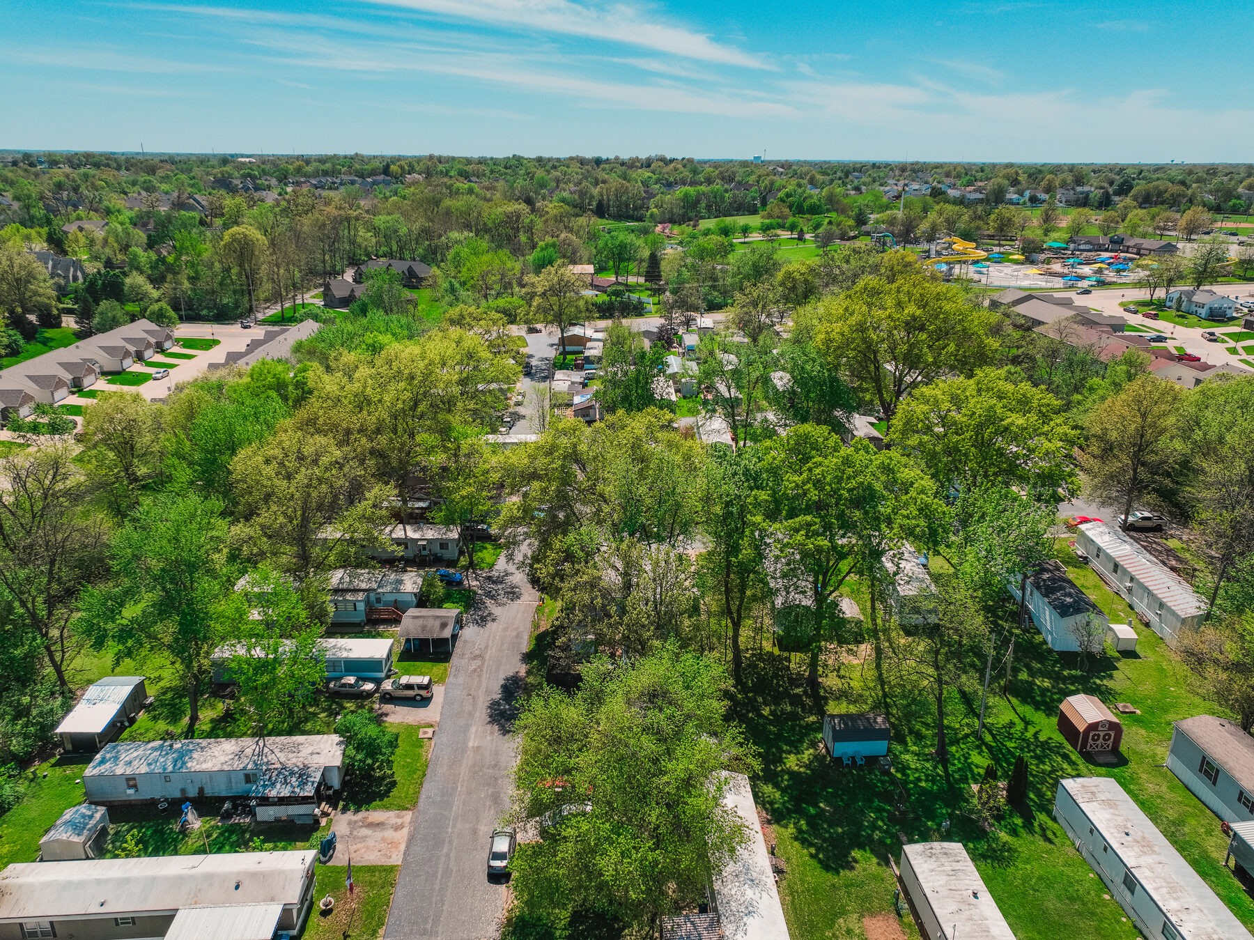 Aerial view of Muegge Manor amid mature trees